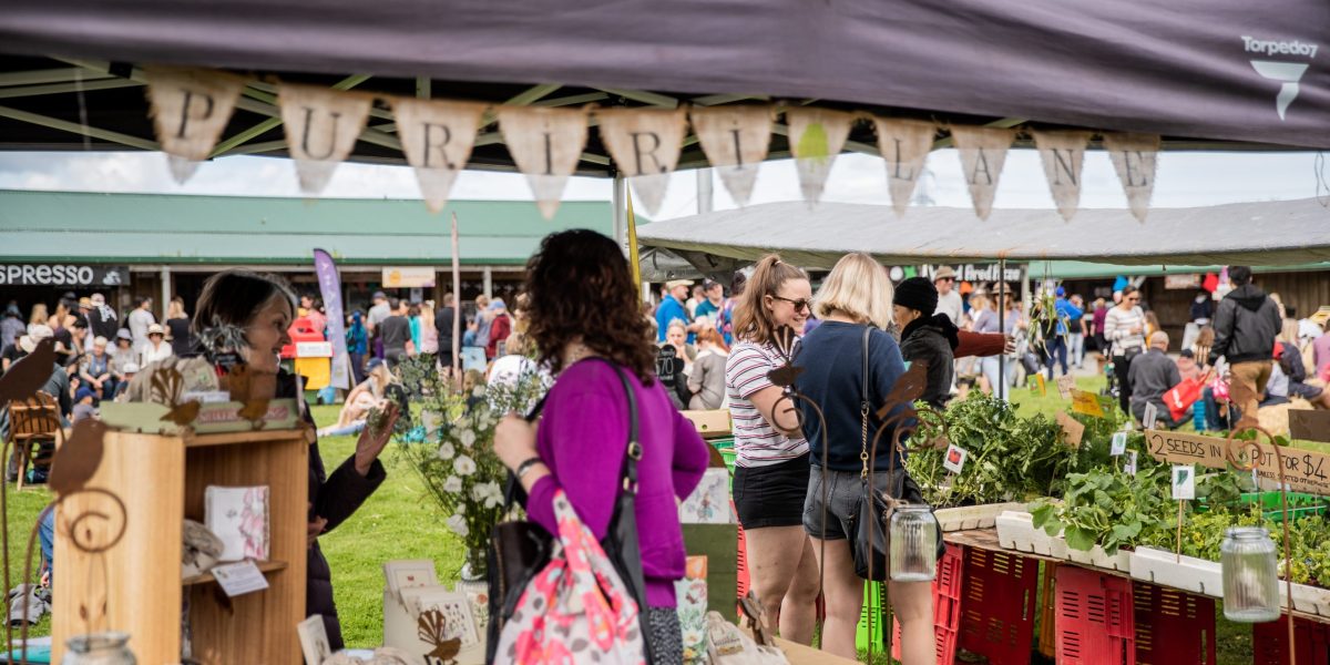 People shopping for crafts and plants at Clevedon Market in Auckland